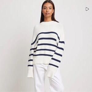 Never worn. Knitted striped sweater